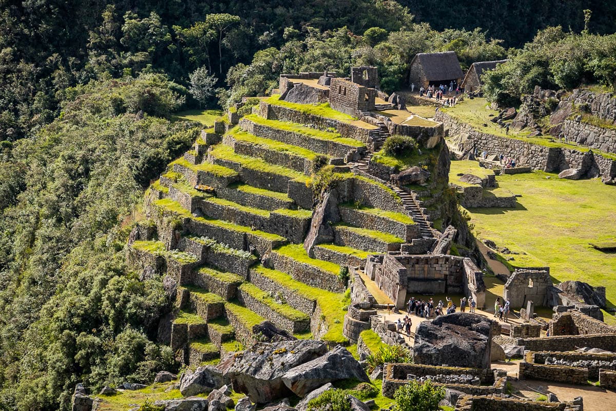 Inca ruins with agricultural terraces along a cliffside in the jungle in Peru
