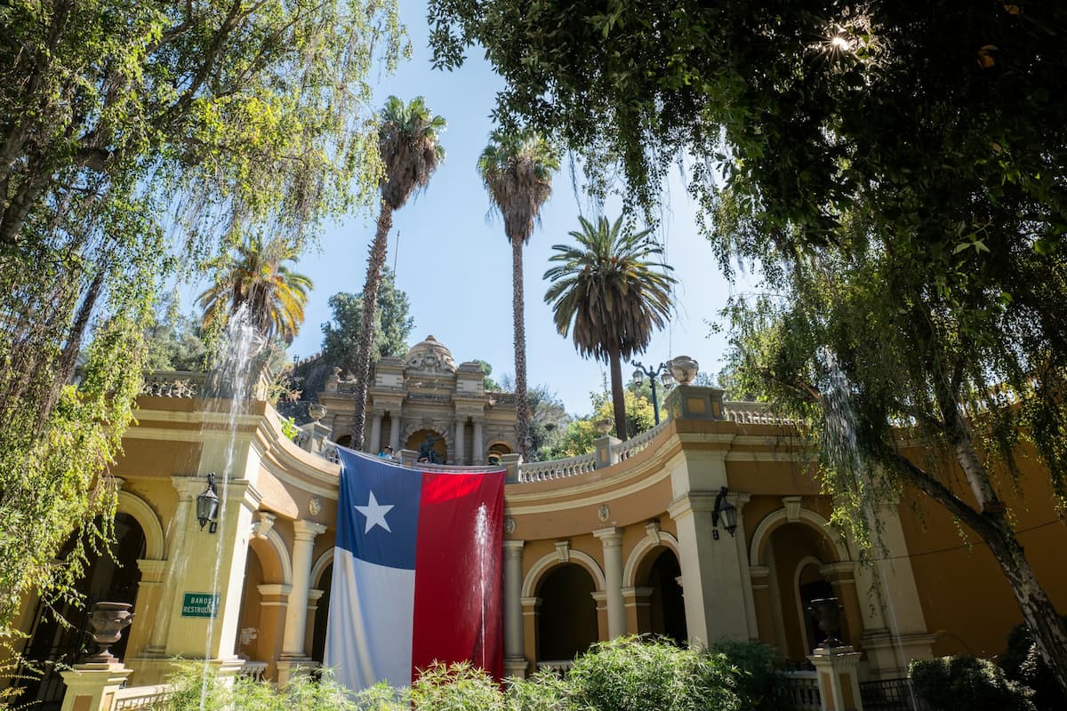 Chilean flag draped over a colonial building in Cerro Santa Lucia in Santiago, Chile