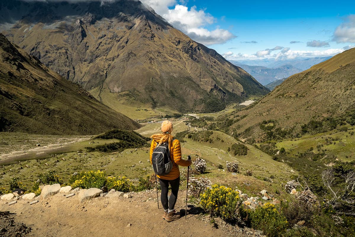 Woman standing on an overlook in the Andes Mountains along the Humantay Lake Trail in Peru
