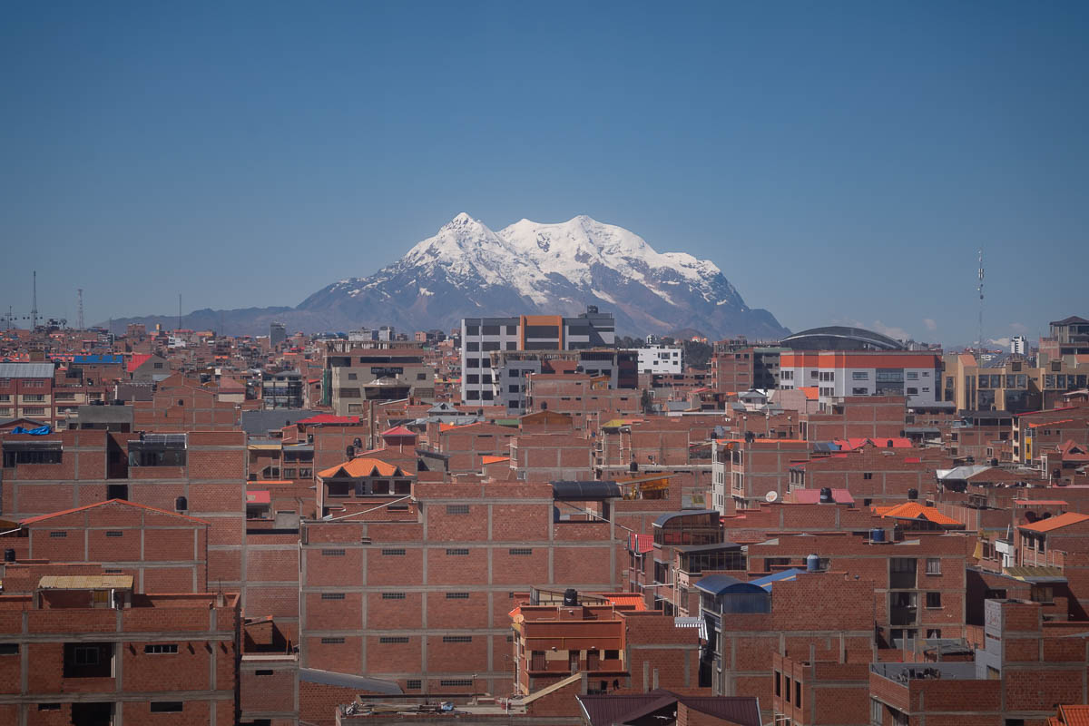 Mountain Illimani behind buildings in El Alto, Bolivia