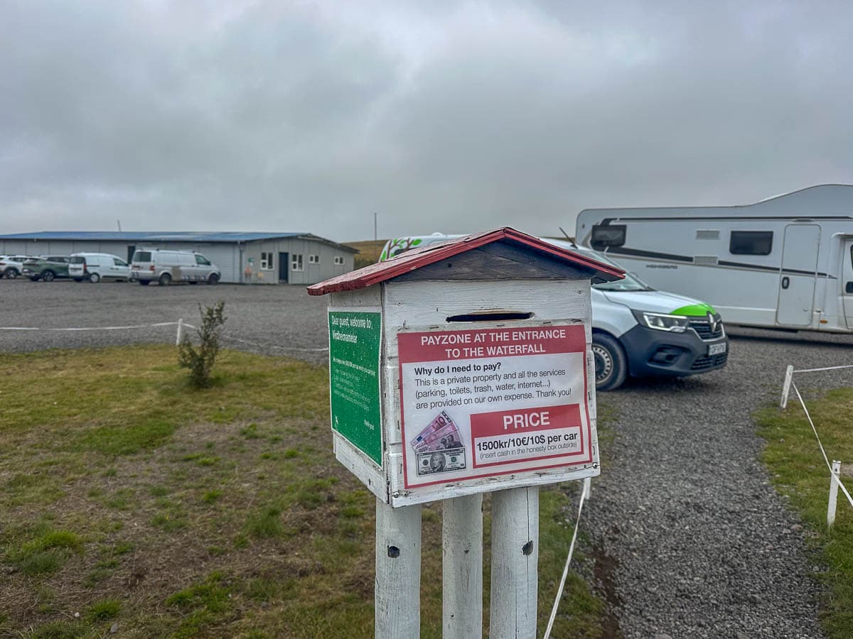 Honesty box in the parking lot for the Fosslaug hot spring and Reykjafoss waterfall in northern Iceland
