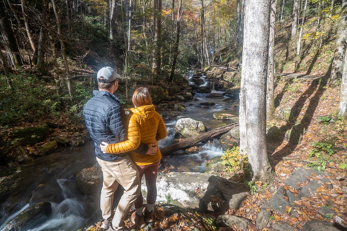 Couple looking at Smith Creek along the Anna Ruby Falls Trail in Helen, Georgia