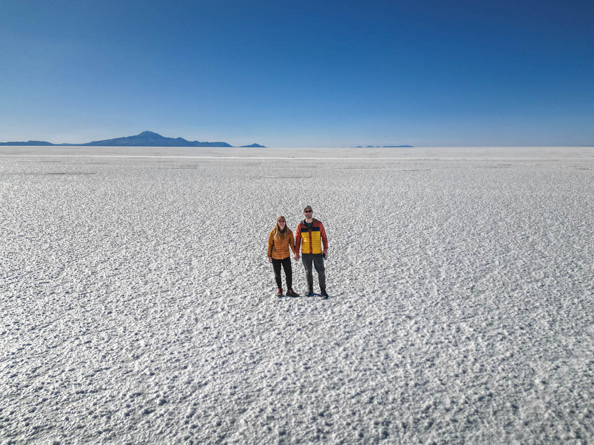 Couple holding hands on the Uyuni Salt Flats outside of Uyuni, Bolivia