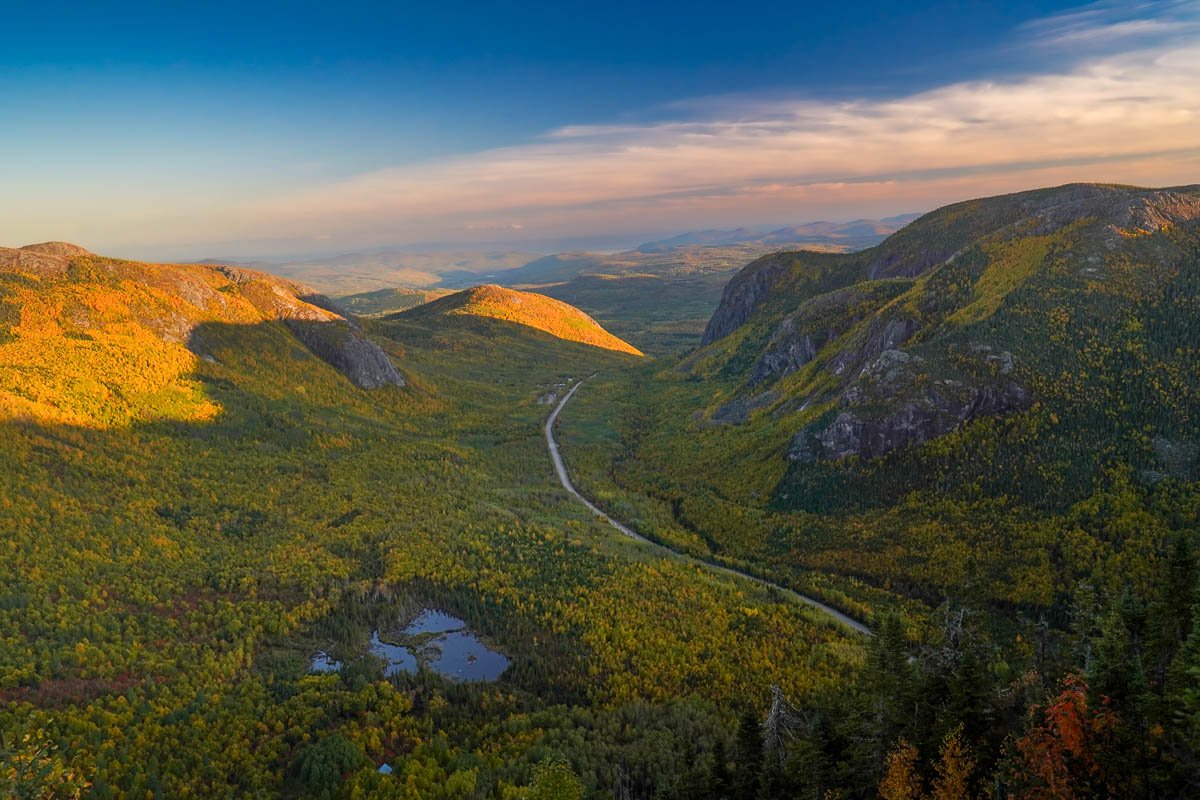 View from Mont du Dome with fall foliage on the surrounding mountains at sunset in Quebec, Canada
