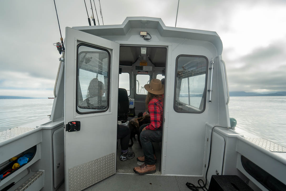 People sitting in a water taxi heading to Kachemak Bay State Park, Alaska