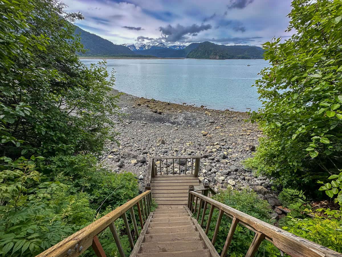 Wooden stairs leading down to a rocky beach in a cove along the Saddle Trail of Kachemak Bay State Park, Alaska