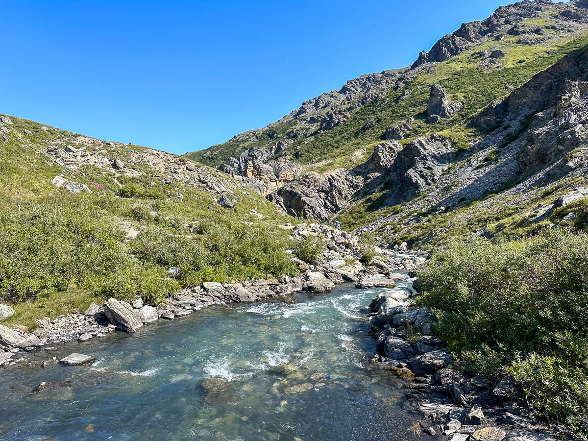 Savage River surrounded by rocky hillsides along the Savage River Loop Trail in Denali National Park, Alaska