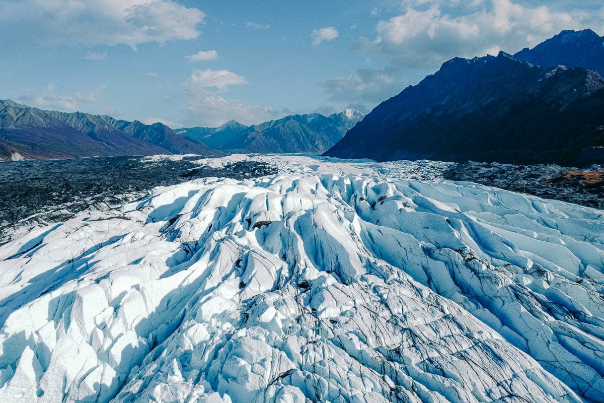 Aerial view of the Matanuska Glacier surrounded by the Chugach Mountains in Alaska