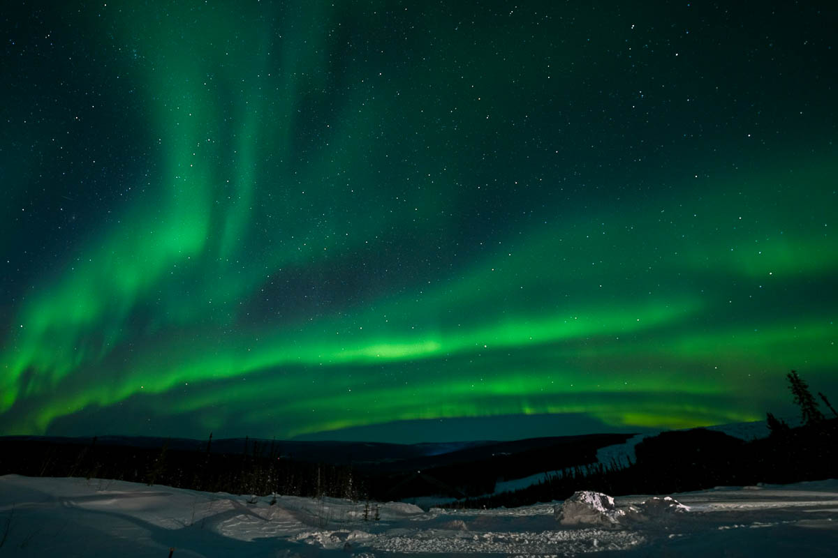 Northern Lights over a snowy tundra in Alaska