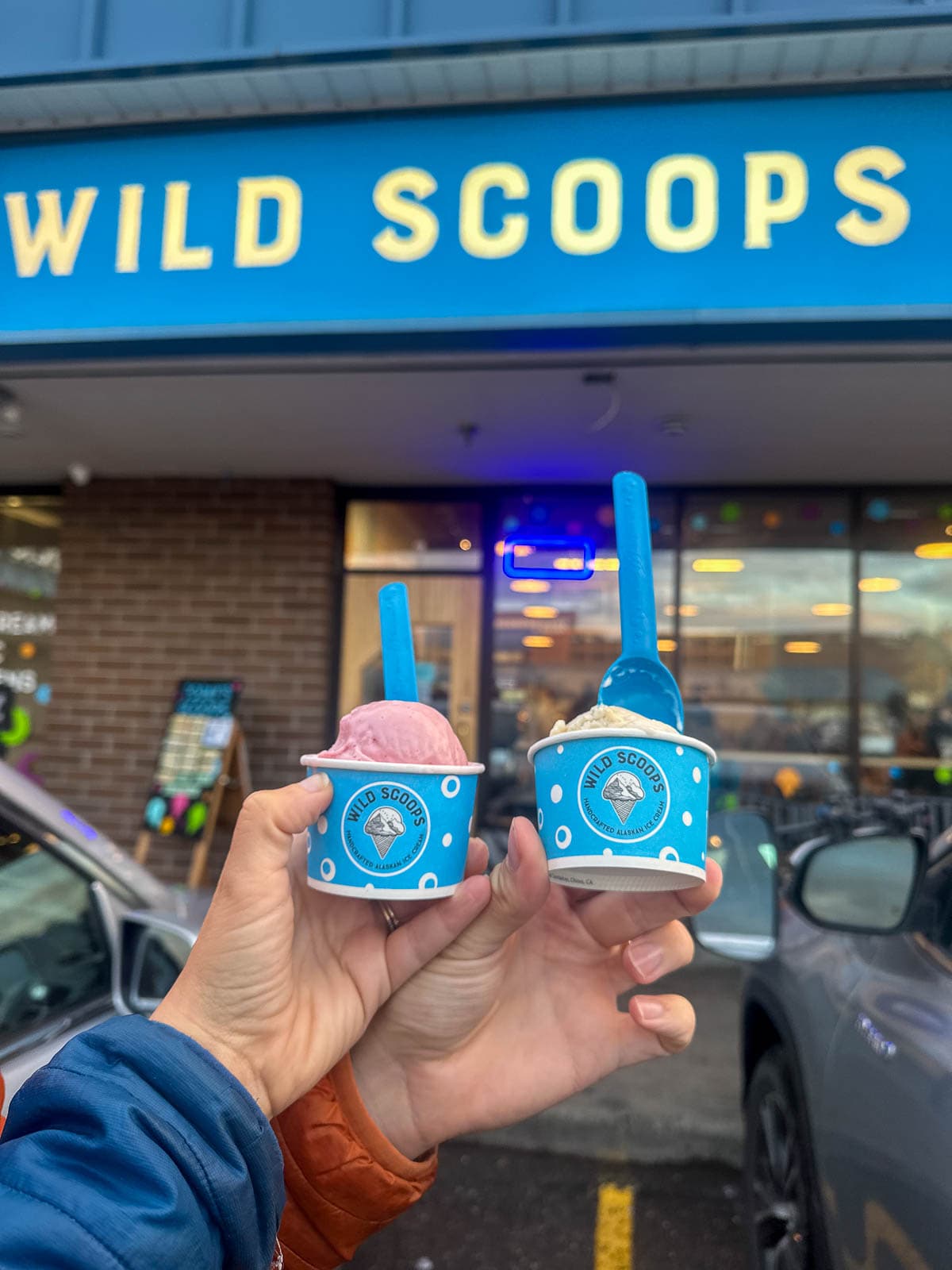 Couple holding ice cream in front of Wild Scoops in Anchorage, Alaska
