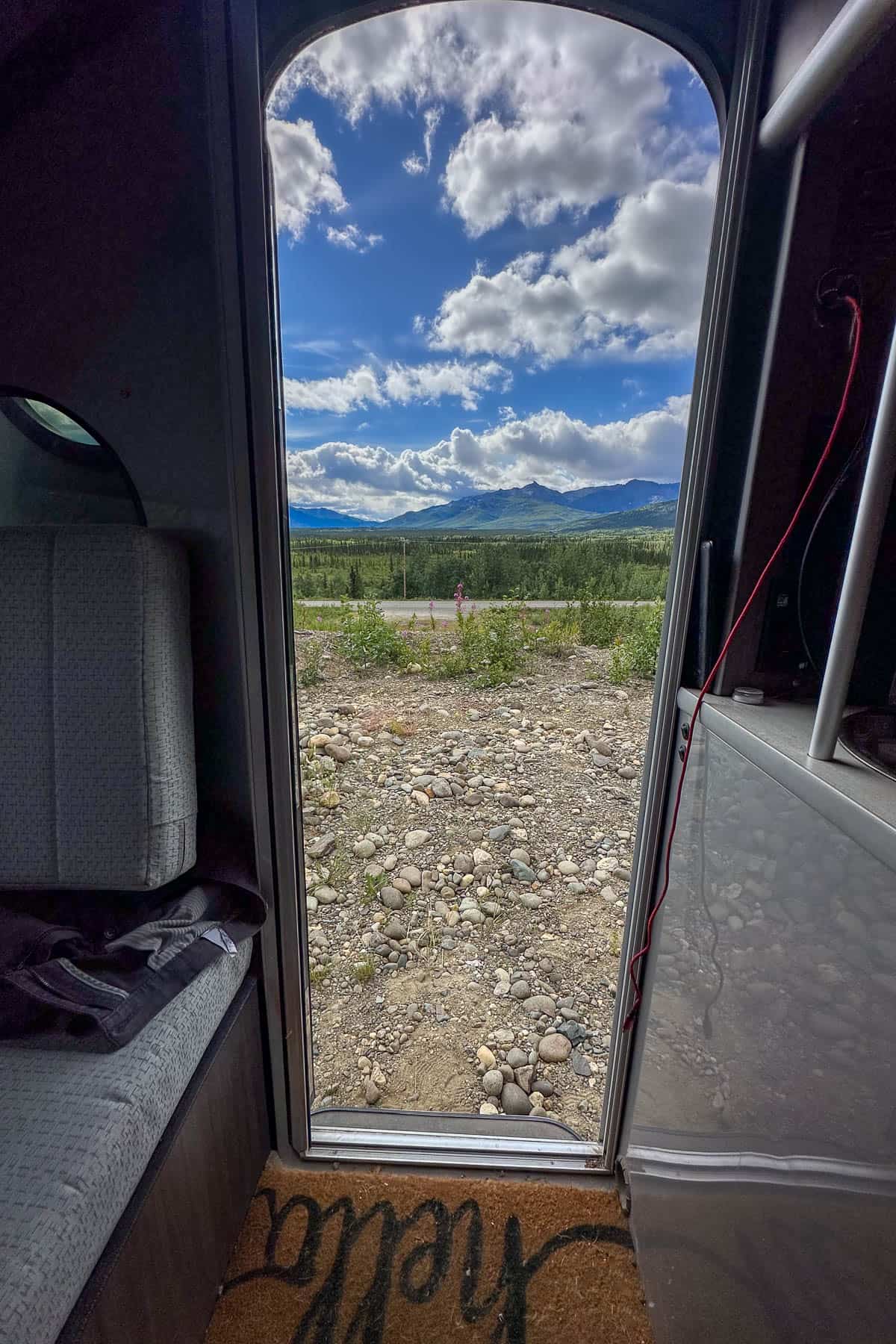View of the Alaska Mountains out of a trailer door outside of Denali National Park, Alaska