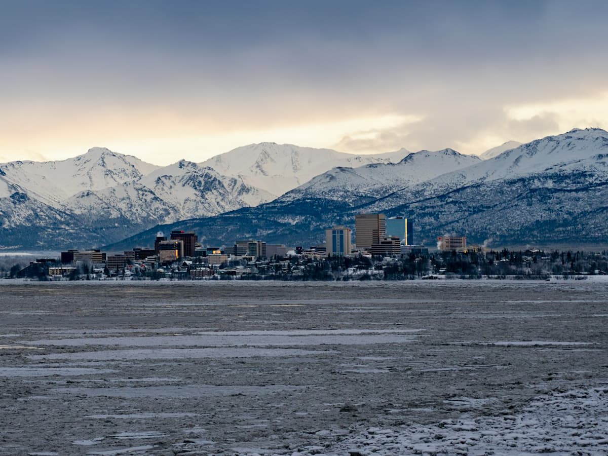 Skyline of Anchorage, Alaska with mountains in the background