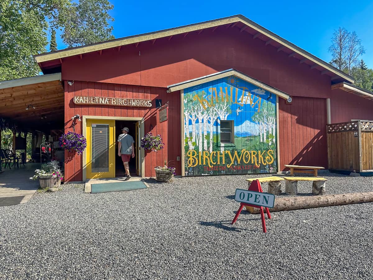 Man walking through the door of Alaska Birch Syrup in Talkeetna, Alaska