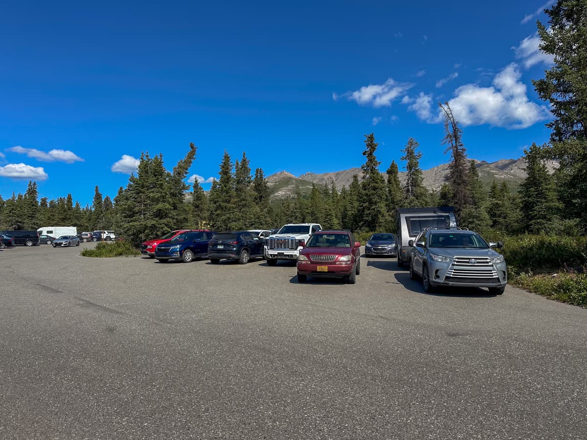 Cars parked in a lot in the Mountain Vista Picnic Area of Denali National Park in Alaska