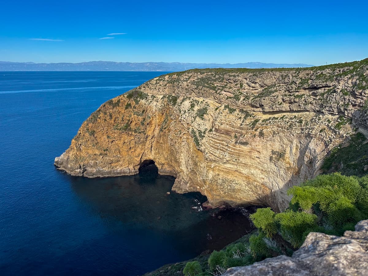 Sea arch with a large cliffside near Potato Harbor on Santa Cruz Island on the Channel Islands National Park, California