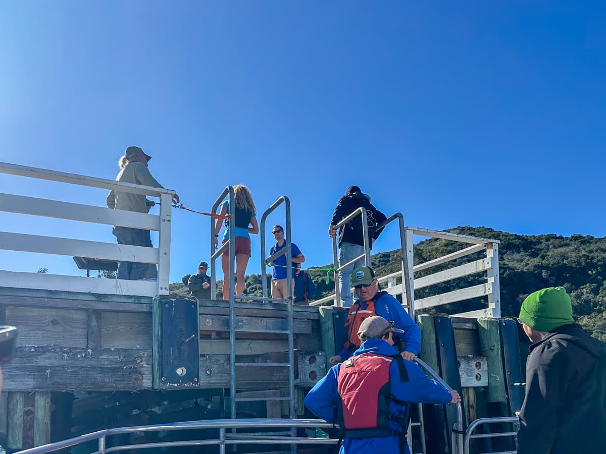 People disembarking at the Prisoners Harbor anchorage from the Island Packers ferry on Santa Cruz Island in Channel Islands National Park, California
