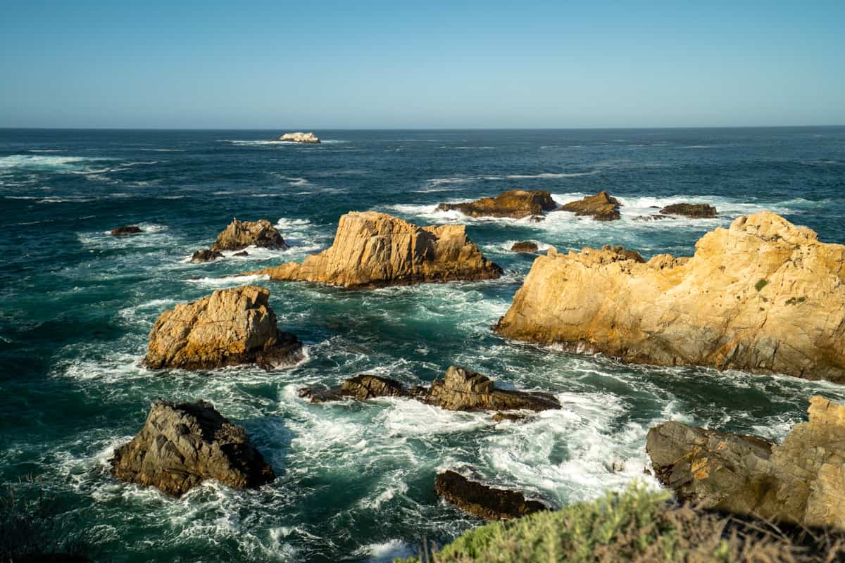 Sea stacks and waves in the Pacific Ocean along the shoreline of Garrapata State Park in Big Sur, California