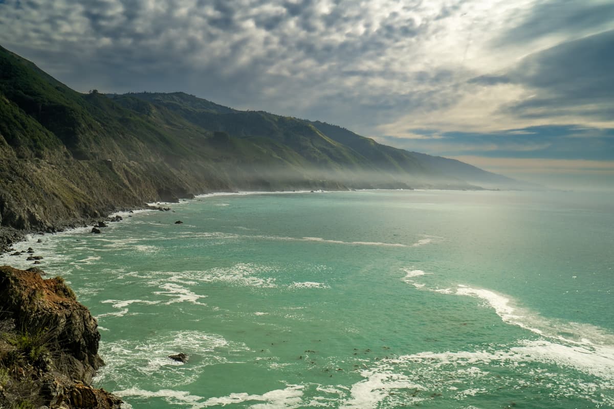 View of cliffsides and the Pacific Ocean from the Seal Beach Overlook in Big Sur, California