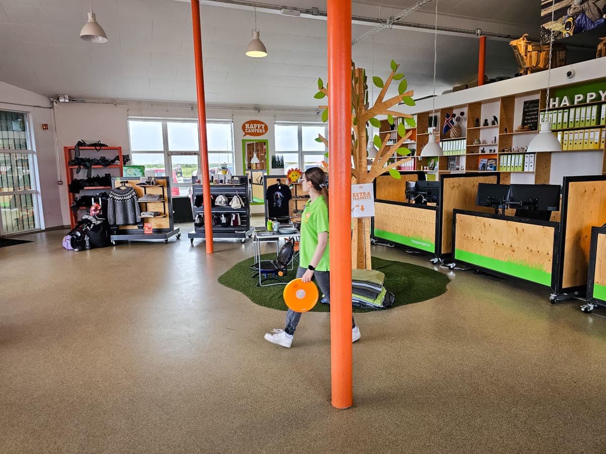 Employee walking through the Happy Campers campervan rental office in Iceland