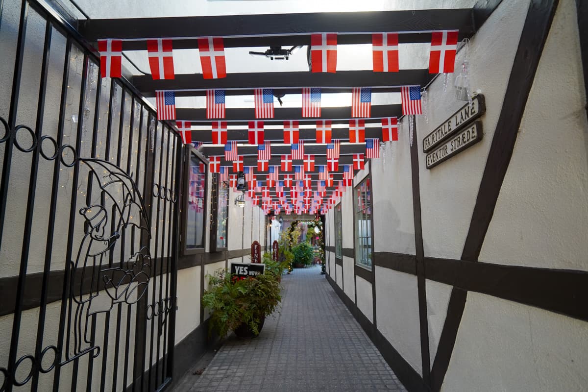 Flags lining a hallway in a building in downtown Solvang, California