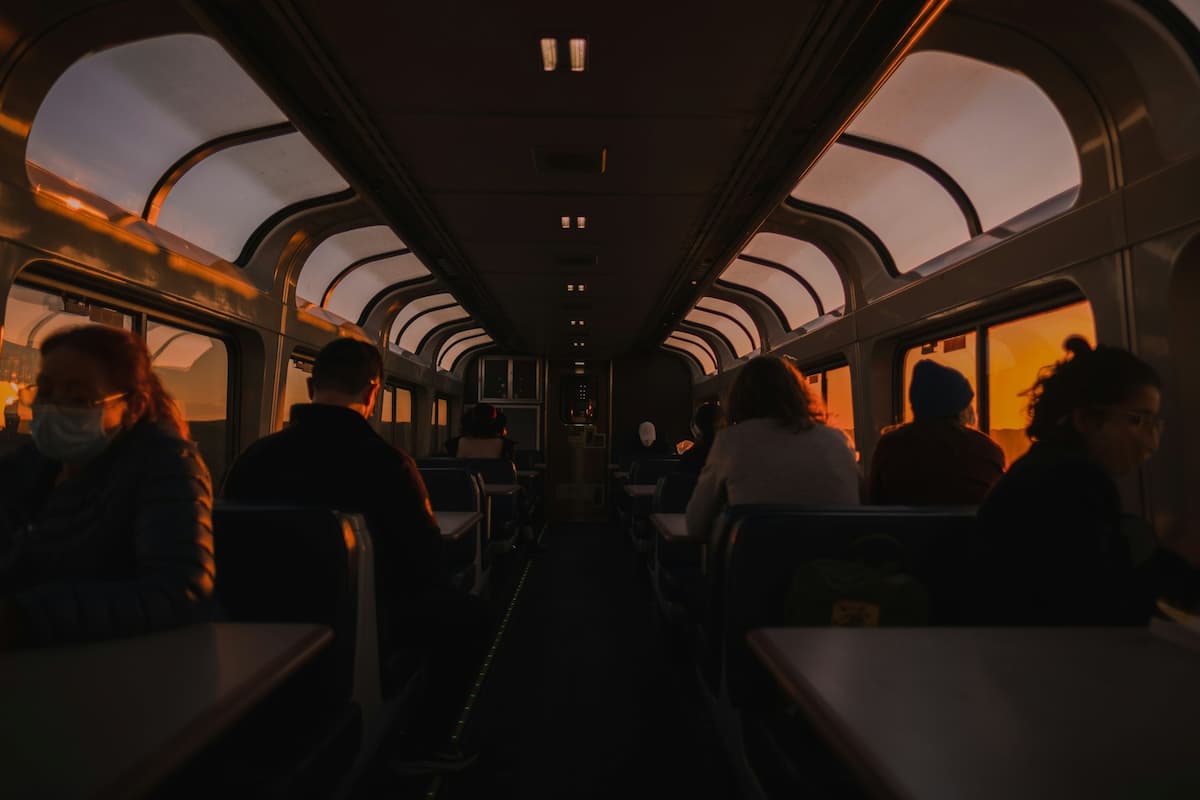 People sitting in a dome car on an Amtrak train in California