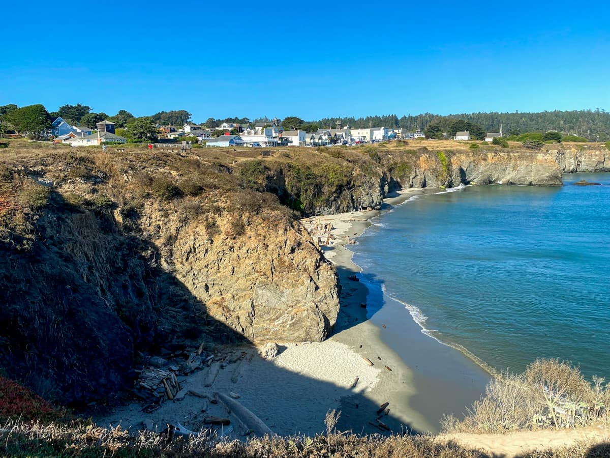 View of the coastal village of Mendocino, California perched on a rocky bluff over the Pacific Ocean